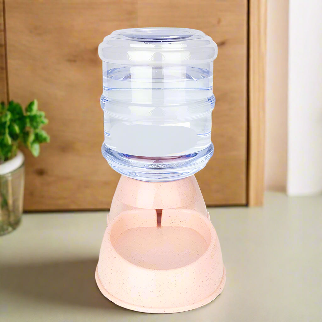 distributeur de croquettes pour chat et eau rose